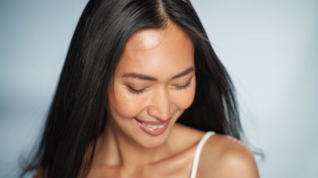 Woman with smooth skin for Sculptra facial aesthetics content