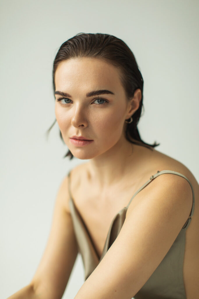 Woman in tank top with dark hair
