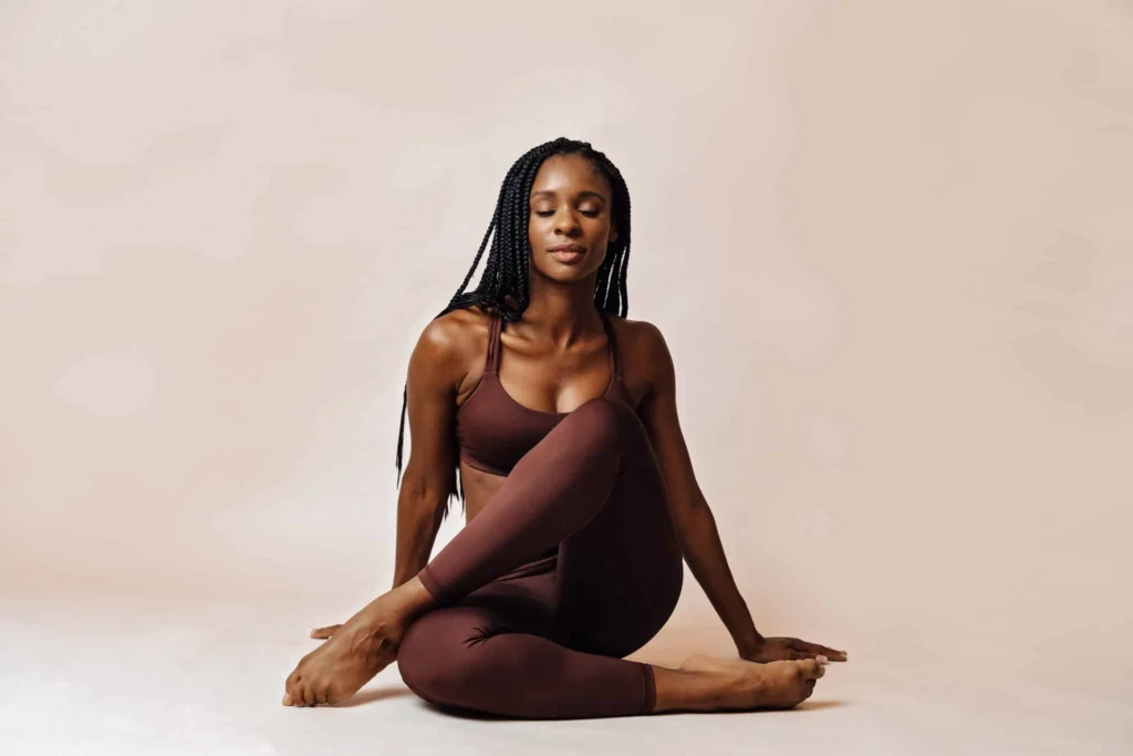 Woman in activewear representing body wellness and aesthetic treatments