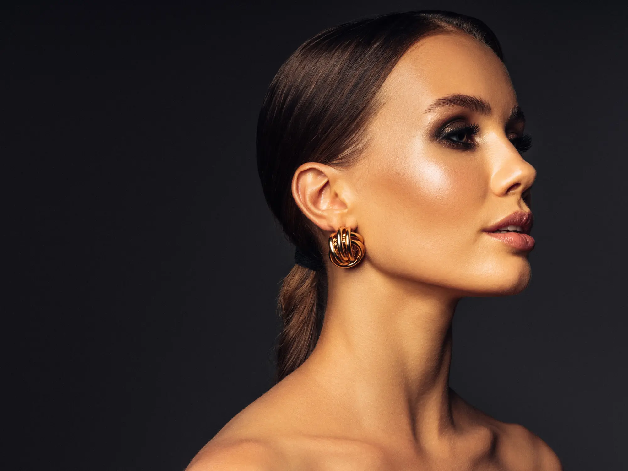 Woman showing lip profile for lip flip and lip filler comparison